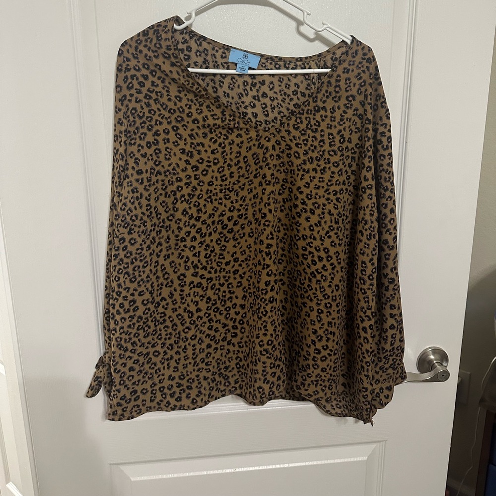 Leopard print long sleeved blouse with bow sleeves.